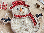 Bandeja sensorial rellenable muñeco de nieve para juego infantil.